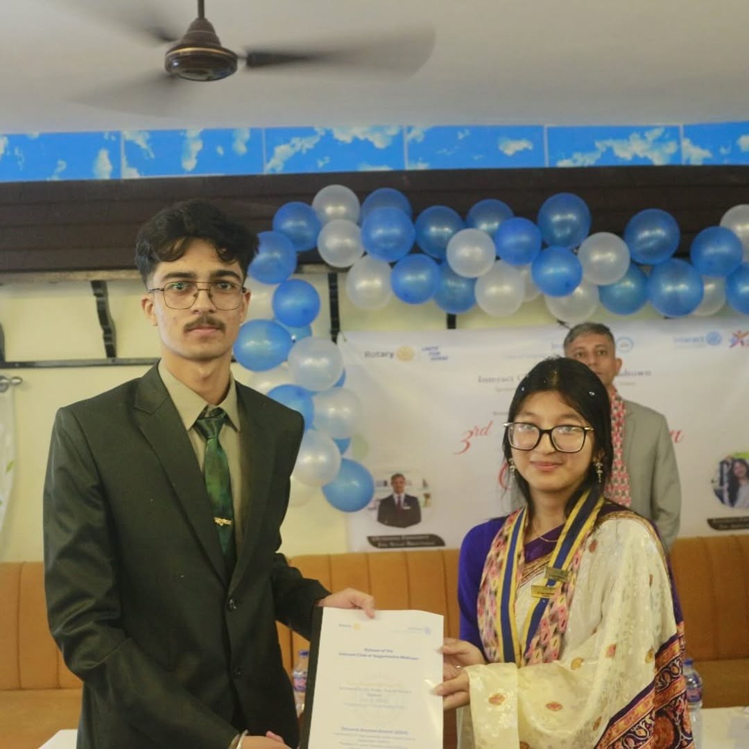 Samir receiving a certificate
